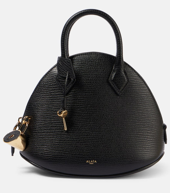Alaia Dome 25 leather tote bag. Shop Alaia Top-Handle Bags for women now.