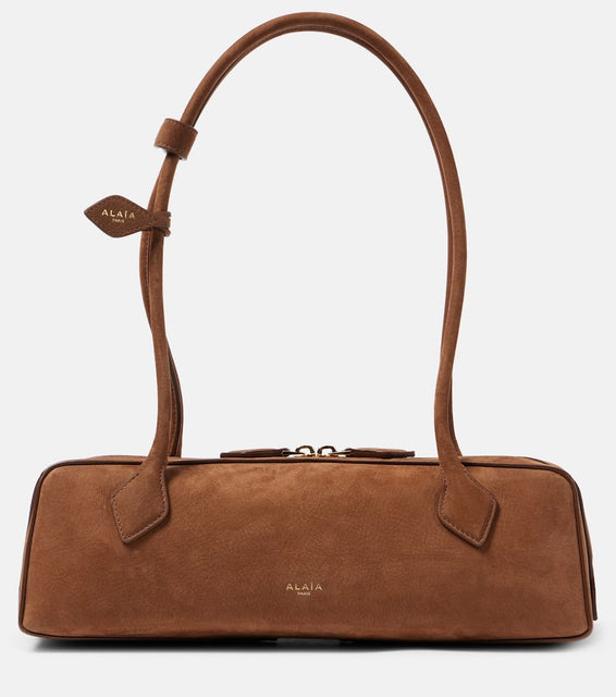 Alaia Le Teckel Medium suede shoulder bag. Shop Alaia Shoulder Bags for women now.