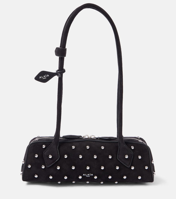Alaia Le Teckel Small studded suede shoulder bag. Shop Alaia Shoulder Bags for women now.
