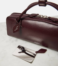 Alaia Le Teckel leather clutch