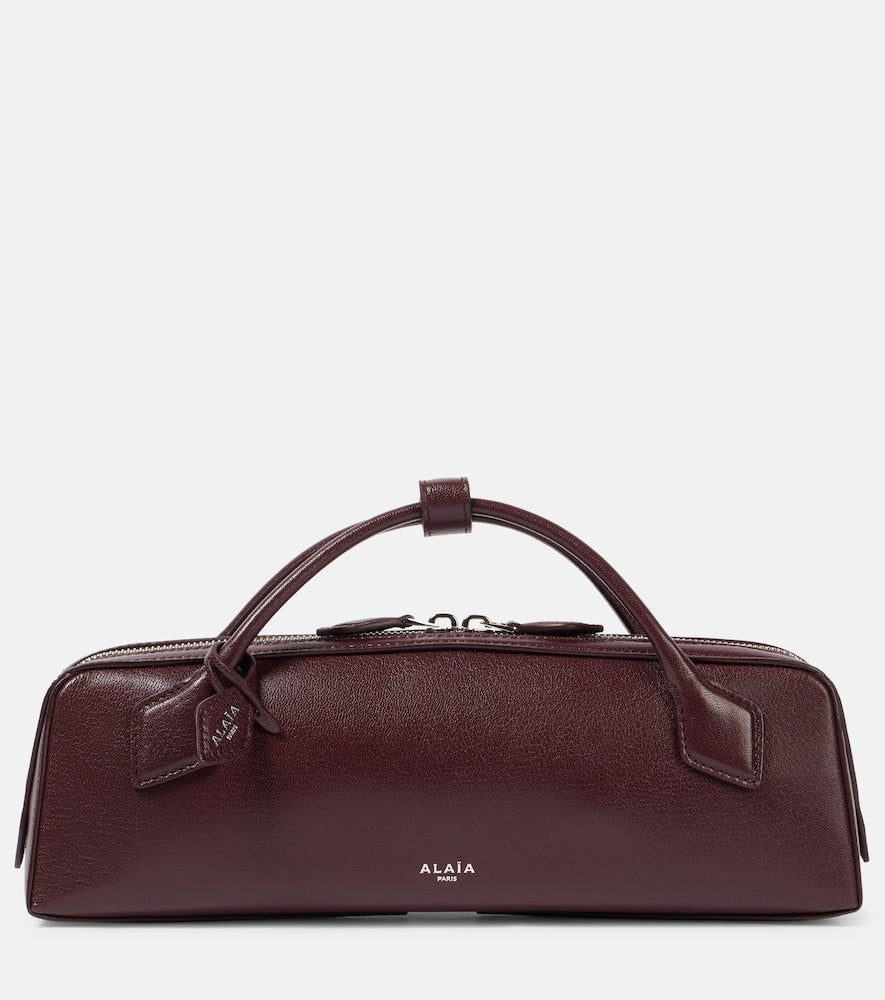 Alaia Le Teckel leather clutch. Shop Alaia Top-Handle Bags for women now.