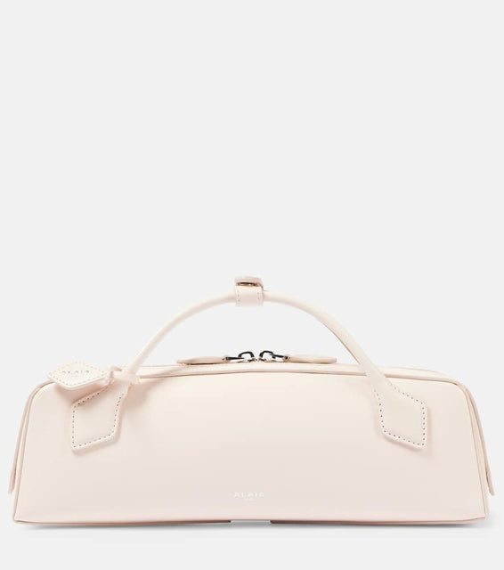 Alaia Le Teckel leather clutch. Shop Alaia Top-Handle Bags for women now.