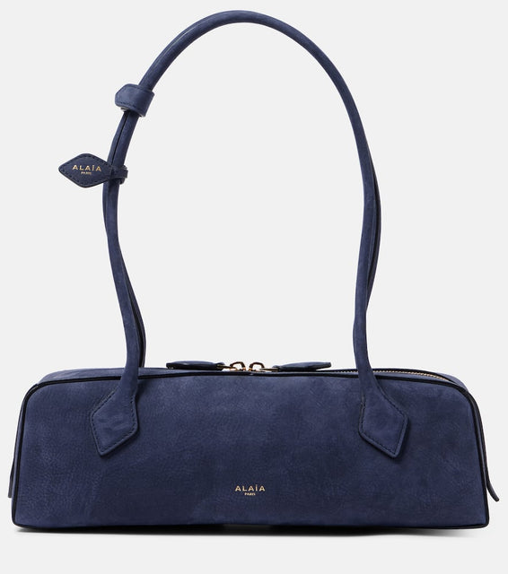 Alaia Le Teckel suede shoulder bag. Shop Alaia Shoulder Bags for women now.