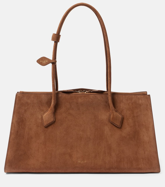 Alaia Le Teckel suede tote bag. Shop Alaia Shoulder Bags for women now.
