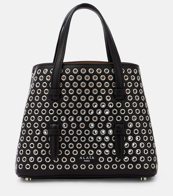 Alaia Mina 20 embellished leather tote bag. Shop Alaia Top-Handle Bags for women now.