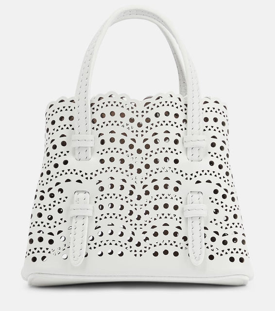 Alaia Mina Mini leather crossbody bag. Shop Alaia Top-Handle Bags for women now.