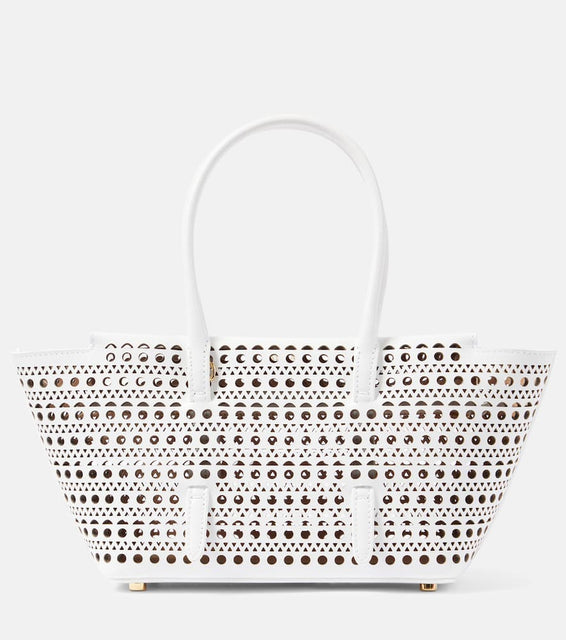 Alaia New Mina 20 leather shoulder bag. Shop Alaia Top-Handle Bags for women now.