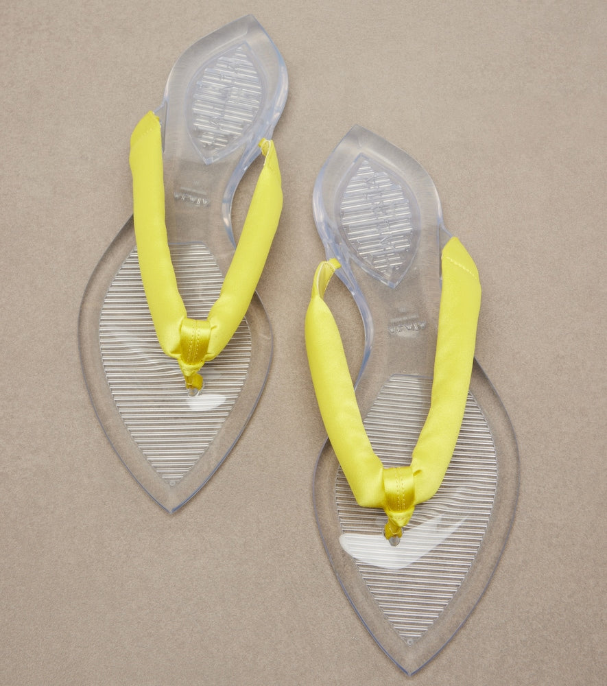 Alaia Invisible satin thong sandals - Yellow Flat Sandals
