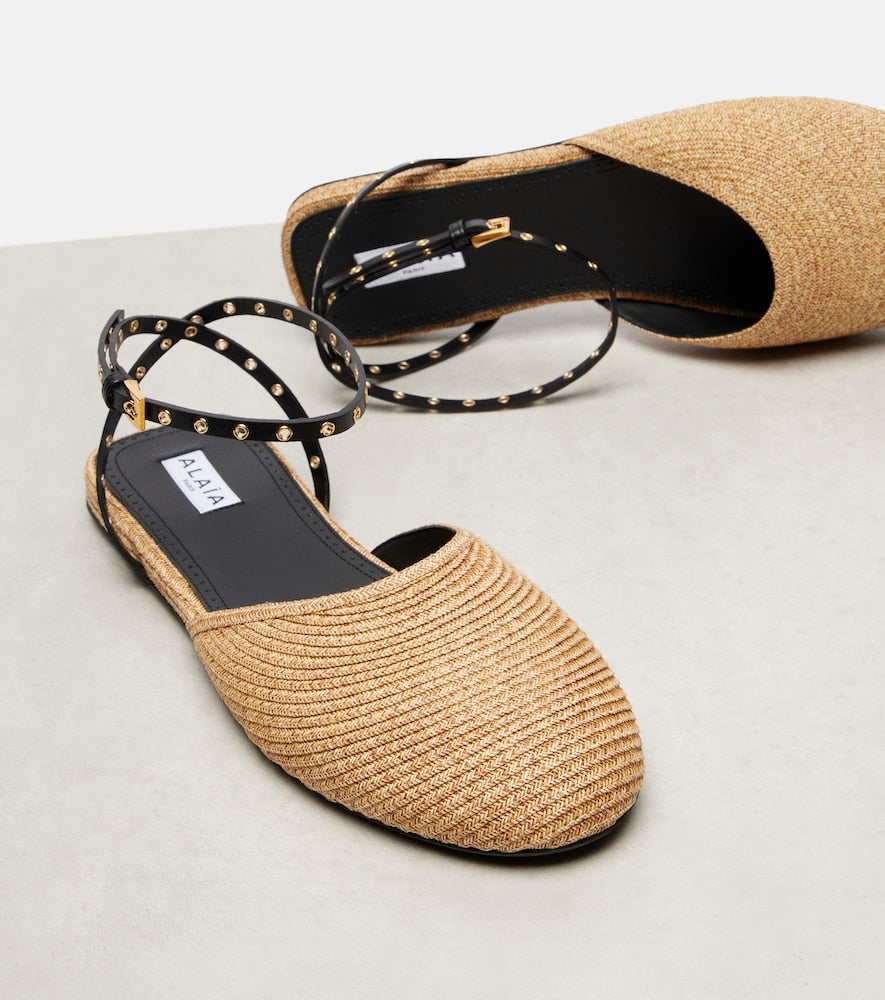 Alaia Leather-trimmed raffia flats (Neutrals) - Mules