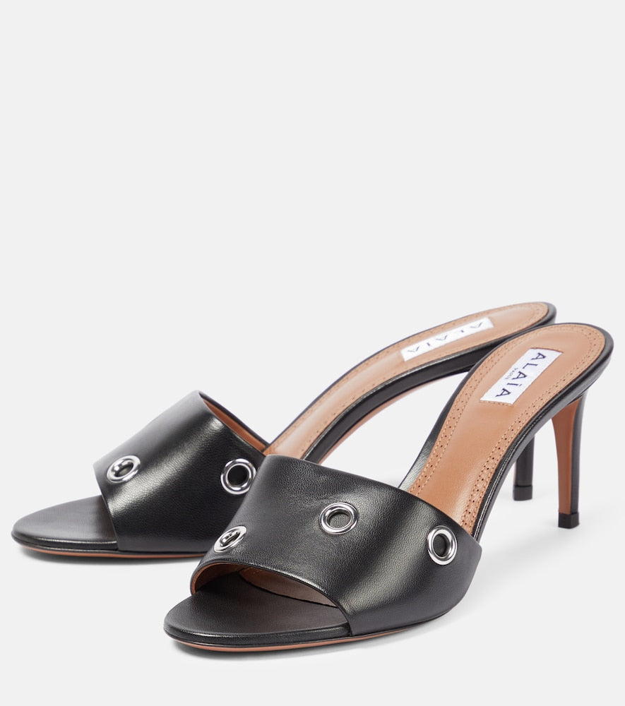 Alaia Oeillets embellished leather sandals (Black) - Mid Heel Sandals
