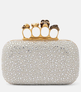Alexander McQueen Skull Knuckle embellished clutch. Shop Alexander McQueen Clutches for women now.