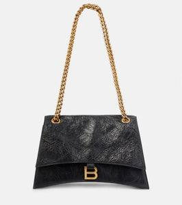 Balenciaga Crush Medium leather shoulder bag. Shop Balenciaga Shoulder Bags for women now.