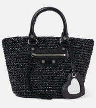 Balenciaga Le Cagole Panier Small raffia-effect basket bag. Shop Balenciaga Top-Handle Bags for women now.