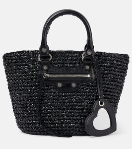Balenciaga Le Cagole Panier Small raffia-effect basket bag. Shop Balenciaga Top-Handle Bags for women now.