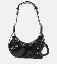 Balenciaga Le Cagole Small leather shoulder bag. Shop Balenciaga Shoulder Bags for women now.