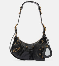 Balenciaga Le Cagole XS leather shoulder bag. Shop Balenciaga Shoulder Bags for women now.