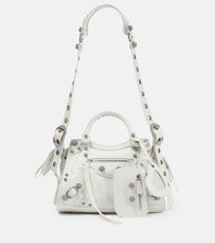 Balenciaga Neo Cagole XS leather shoulder bag. Shop Balenciaga Shoulder Bags for women now.