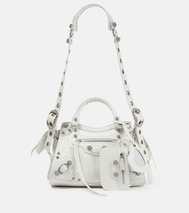Balenciaga Neo Cagole XS leather shoulder bag. Shop Balenciaga Shoulder Bags for women now.