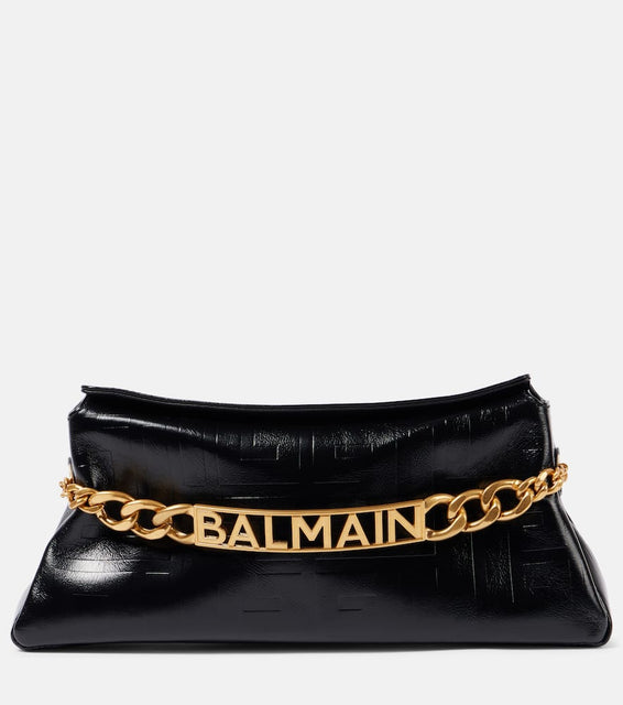Balmain 1945 PB embossed leather clutch. Shop Balmain Clutches for women now.