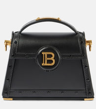Balmain B-Buzz Dynasty Small leather shoulder bag. Shop Balmain Top-Handle Bags for women now.