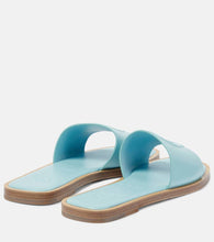 Christian Louboutin CL embossed leather mules