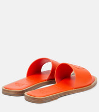 Christian Louboutin CL embossed leather mules