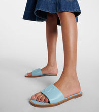 Christian Louboutin CL embossed leather mules