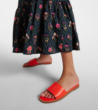 Christian Louboutin CL embossed leather mules