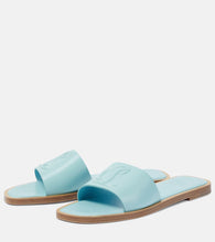 Christian Louboutin CL embossed leather mules