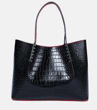 Christian Louboutin Cabarock Large studded leather tote. Shop Christian Louboutin Tote Bags for women now.