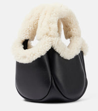 Coperni Swipe Mini faux fur-trimmed leather bucket bag