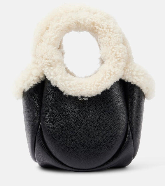 Coperni Swipe Mini faux fur-trimmed leather bucket bag. Shop Coperni Top-Handle Bags for women now.