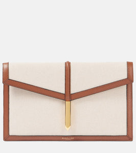 DeMellier Tokyo leather-trimmed canvas clutch. Shop DeMellier Clutches for women now.