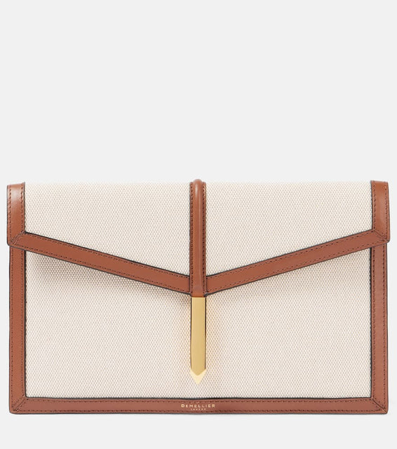 DeMellier Tokyo leather-trimmed canvas clutch. Shop DeMellier Clutches for women now.