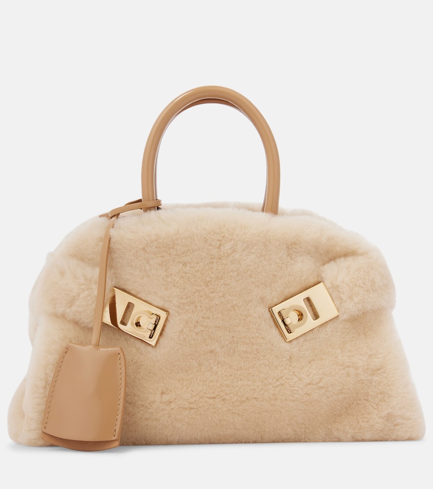 Ferragamo Hug Small shearling tote bag. Shop Ferragamo Top-Handle Bags for women now.