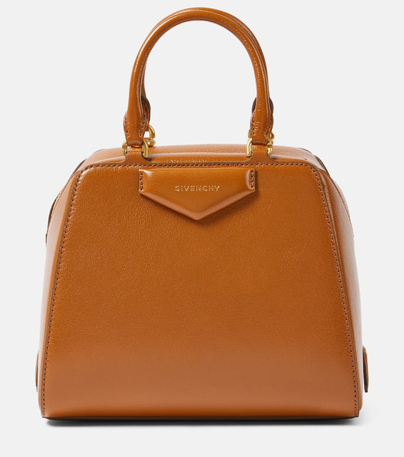 Givenchy Antigona Cube Mini leather tote bag. Shop Givenchy Top-Handle Bags for women now.