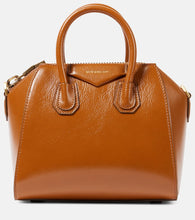 Givenchy Antigona Mini leather tote bag. Shop Givenchy Top-Handle Bags for women now.