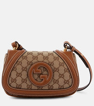 Gucci Blondie GG canvas Mini shoulder bag. Shop Gucci Top-Handle Bags for women now.