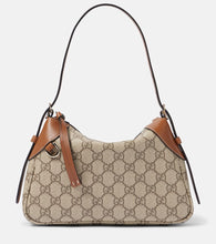 Gucci GG Canvas Small shoulder bag. Shop Gucci Shoulder Bags for women now.