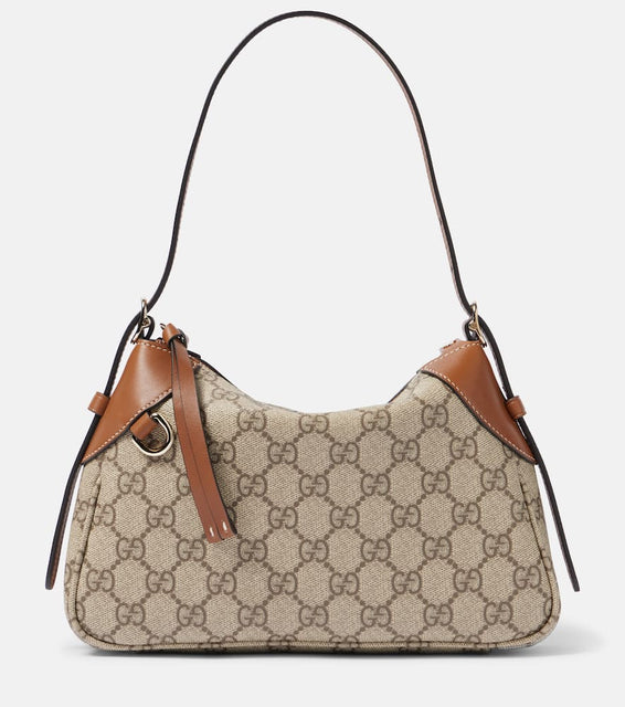Gucci GG Canvas Small shoulder bag. Shop Gucci Shoulder Bags for women now.