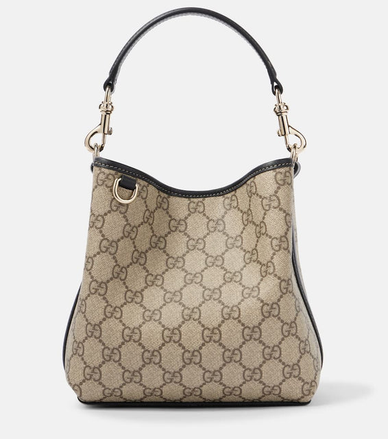 Gucci GG Emblem Mini coated canvas tote bag. Shop Gucci Top-Handle Bags for women now.