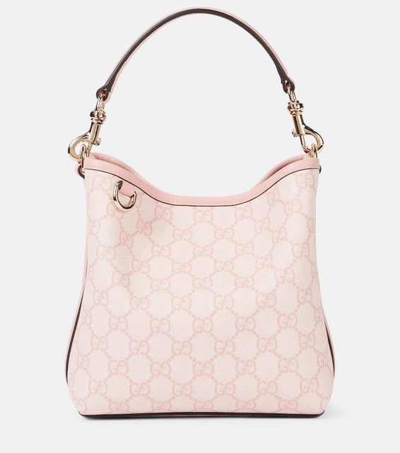 Gucci GG Emblem Mini leather-trimmed bucket bag. Shop Gucci Bucket Bags for women now.
