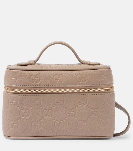 Gucci GG Emblem Super Mini vanity bag. Shop Gucci Top-Handle Bags for women now.