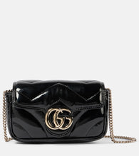 Gucci GG Marmont Mini patent leather shoulder bag. Shop Gucci Crossbody Bags for women now.