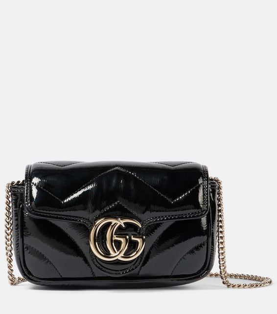 Gucci GG Marmont Mini patent leather shoulder bag. Shop Gucci Crossbody Bags for women now.