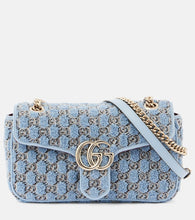 Gucci GG Marmont Small boucl√É¬© shoulder bag. Shop Gucci Shoulder Bags for women now.