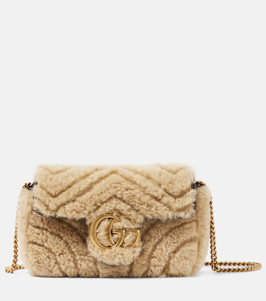 Gucci GG Marmont Super Mini shearling shoulder bag. Shop Gucci Crossbody Bags for women now.