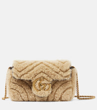 Gucci GG Marmont Super Mini shearling shoulder bag. Shop Gucci Crossbody Bags for women now.
