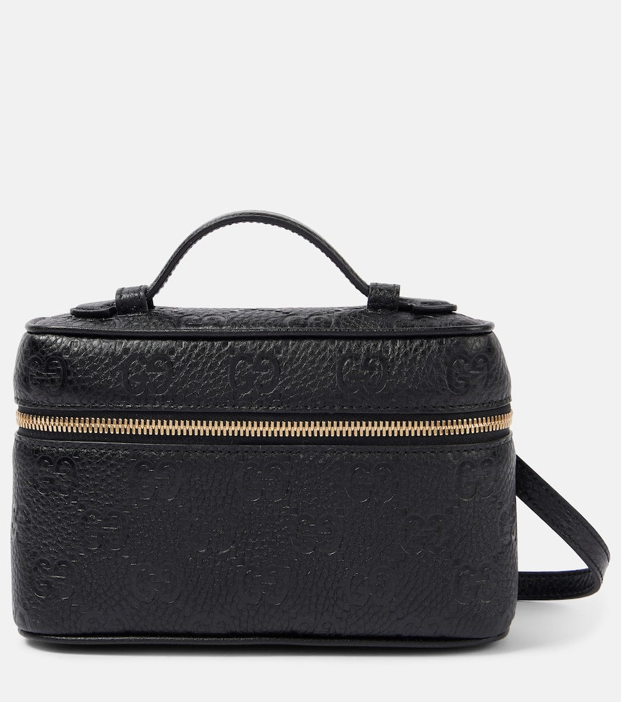 Gucci GG Super Mini debossed leather tote bag. Shop Gucci Top-Handle Bags for women now.