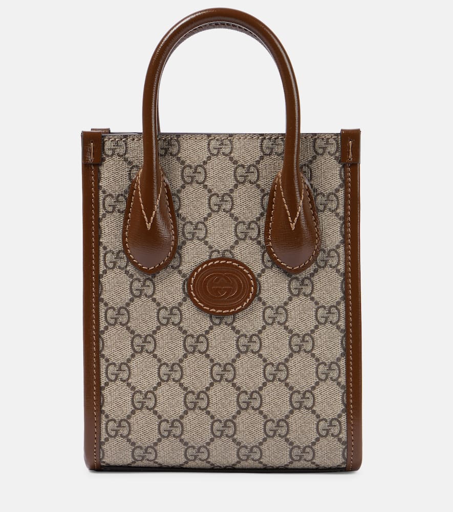 Gucci GG Supreme Mini canvas tote. Shop Gucci Top-Handle Bags for women now.